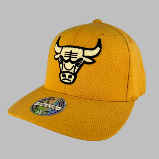 Chicago Bulls 110 Snapback Cap  - A yellow cap with balc and white Bulls logo. the peak has a M & S 110 hologram sticker